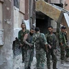Binh sỹ Syria làm nhiệm vụ tại khu vực Bustan al-Basha, Aleppo ngày 6/10. (Nguồn: AFP/TTXVN)