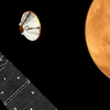 Hình ảnh mô phỏng module đổ bộ Schiaparelli tách khỏi "tàu mẹ" module TGO và tiến tới Sao Hỏa. (Nguồn: EPA/TTXVN)