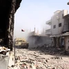 Các binh sỹ trung thành với Chính phủ trong chiến dịch truy quét phiến quân IS tại Sirte ngày 14/10. (Nguồn: THX/TTXVN)