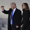 Tổng thống đắc cử Donald Trump (trái) và phu nhân Melania Trump (phải) tại Washington, DC ngày 19/1. (Nguồn: AFP/TTXVN)