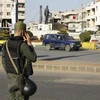  Lực lượng an ninh Chính phủ Syria gác tại một trạm kiểm soát ở Homs. (Nguồn: AFP/TTXVN)