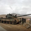  Binh sỹ quân đội Chính phủ Syria sau khi giành lại quyền kiểm soát thành cổ Palmyra từ tay IS ngày 2/3. (Nguồn: AFP/TTXVN)