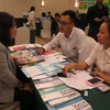 Các doanh nghiệp Thái Lan và doanh nghiệp Việt Nam trao đổi, giao lưu tại hội thảo. (Ảnh: Hoàng Hải/TTXVN)