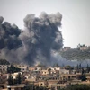 Khói bốc lên sau một đợt không kích ở Deraa. (Nguồn: AFP/TTXVN)