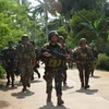 Binh sỹ Philippines tuần tra tại khu vực làng Bongkaong, thị trấn Patikul, tỉnh Sulu, đảo Mindanao. (Nguồn: AFP/TTXVN)