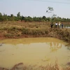 Những hố nước tưới càphê ở Gia Lai rất dễ xảy ra các vụ đuối nước thương tâm. (Ảnh: Nguyễn Hoài Nam/TTXVN)