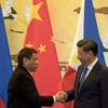 Chủ tịch Trung Quốc Tập Cận Bình (phải) và Tổng thống Philippines Rodrigo Duterte. (Nguồn: AFP/TTXVN)