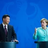  Chủ tịch Trung Quốc Tập Cận Bình (trái) và Thủ tướng Đức Angela Merkel (phải) tại cuộc họp báo ở Berlin ngày 5/7. (Nguồn: AFP/TTXVN)