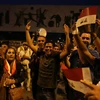  Người dân Iraq tập trung tại quảng trường Tahrir ở thủ đô Baghdad, mừng thành phố Mosul được giải phóng hoàn toàn khỏi IS ngày 9/7. (Nguồn: THX/TTXVN)