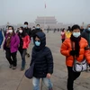 Người dân đeo khẩu trang tránh ô nhiễm tại thủ đô Bắc Kinh, Trung Quốc ngày 21/12/2016. (Nguồn: AFP/TTXVN)