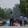 Cảnh sát Trung Quốc điều tra tại hiện trường một đánh bom tại trường mầm non ở tỉnh Giang Tô. (Nguồn: AFP/TTXVN)