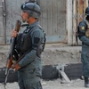Cảnh sát Afghanistan gác tại hiện trường vụ đánh bom ở Kabul ngày 29/9. (Nguồn: AFP/TTXVN)