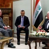 Ngoại trưởng Mỹ Rex Tillerson (trái) và Tổng thống Iraq Fuad Massum (phải) tại cuộc gặp ở Baghdad ngày 23/10. (Nguồn: AFP/TTXVN)