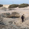 Hiện trường một vụ không kích của Israel nhằm vào căn cứ của phòng trào Hamas tại thị trấn Khan Yunis, dải Gaza. (Nguồn: AFP/TTXVN)