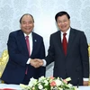 Thủ tướng Nguyễn Xuân Phúc và Thủ tướng nước CHDCND Lào Thongloun Sisoulith. (Ảnh: Thống Nhất/TTXVN .)