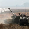 Binh sỹ và pháo binh Israel tham gia diễn tập gần khu vực biên giới Israel-Syria tại Cao nguyên Golan ngày 19/11. (Nguồn: AFP/TTXVN)