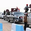 Đoàn xe chở lực lượng ủng hộ Chính phủ Syria tiến vào vùng Afrin ngày 20/2. (Nguồn: AFP/TTXVN)