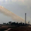  Quân đội Thổ Nhĩ Kỳ nã pháo vào Afrin từ thị trấn Reyhanli, tỉnh Hatay ngày 12/2. (Nguồn: THX/TTXVN)