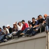  Người di cư Trung Mỹ tới bang Chiapas, Mexico để tìm đường sang Mỹ ngày 16/7/2014. (Nguồn: AFP/TXTVN)
