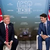 Tổng thống Mỹ Donald Trump và Thủ tướng Canada Justin Trudeau. (Nguồn: AFP/TTXVN)