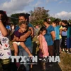  Người di cư di chuyển tới khu vực biên giới Mexico - Mỹ tại Matias Romero, bang Oaxaca, Mexico ngày 3/4. (Nguồn: AFP/TTXVN)