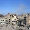  Khói bốc lên sau một cuộc không kích nhằm vào IS tại Deir al-Zour, Syria ngày 3/11/2017. (Nguồn: AFP/TTXVN)