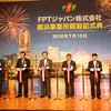 Các đại biểu cắt băng khai trương văn phòng của FPT tại thành phố Yokohama, tỉnh Kanagawa, Nhật Bản. (Ảnh: Hồng Hà/TTXVN)