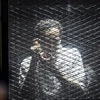 Một thành viên tổ chức Anh em Hồi giáo (MB) tại phiên tòa xét xử ở Cairo, Ai Cập ngày 28/7. (Nguồn: AFP/TTXVN)