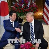 Tổng thống Mỹ Donald Trump (phải) và Thủ tướng Nhật Bản Shinzo Abe tại cuộc gặp ở Florida, Mỹ ngày 17/4. (Nguồn: AFP/TTXVN)