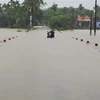  Đường giao thông ở thị trấn Phong Điền, huyện Phong Điền bị ngập lụt. (Ảnh: Hồ Cầu/TTXVN)