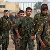 Các tay súng YPG tại Deir Ezzor, Qamishli, Syria. (Ảnh: AFP/TTXVN)