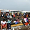 Người di cư Honduras tại khu vực Ciudad Tecun Uman ở biên giới Guatemala-Mexico, trong hành trình tới Mỹ ngày 21/10/2018. (Ảnh: AFP/TTXVN)