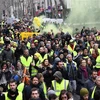Người biểu tình "Áo vàng" lại tuần hành ở thủ đô Paris ngày 26/1. (Ảnh: AFP/TTXVN)