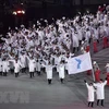 Tại lễ khai mạc Olympic PyeongChang 2018 ngày 9/2, đoàn vận động viên Hàn Quốc và Triều Tiên đã cùng diễu hành chung dưới lá cờ thống nhất. (Nguồn: AFP/TTXVN