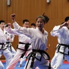 Đội Taekwondo của Triều Tiên biểu diễn tại Thế vận hội mùa đông PyeongChang ở Hàn Quốc ngày 12/2/2018. (Ảnh: AFP/TTXVN) 