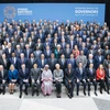 Các đại biểu chụp ảnh lưu niệm tại Hội nghị mùa Xuân của Quỹ Tiền tệ quốc tế (IMF) và Ngân hàng Thế giới (WB) diễn ra ở Washington (Mỹ), ngày 13/4. (Ảnh: AFP/TTXVN) 