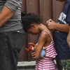 Người di cư trong hành trình tới Mỹ chờ được hỗ trợ tại trại tị nạn ở Tapachula, bang Chiapas (Mexico) ngày 11/6/2019. (Ảnh: AFP/TTXVN)