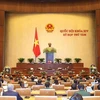 Thủ tướng Chính phủ Nguyễn Xuân Phúc trình bày Báo cáo về kết quả thực hiện kế hoạch phát triển kinh tế - xã hội năm 2019; kế hoạch phát triển kinh tế-xã hội năm 2020. (Ảnh: Dương Giang/TTXVN)