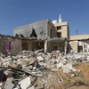 Hiện trường một vụ không kích tại khu vực ngoại ô Tripoli, Libya, ngày 14/10/2019. (Ảnh: AFP/TTXVN)