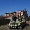 Lực lượng an ninh Afghanistan được triển khai tới hiện trường vụ đánh bom nhằm vào căn cứ quân sự Bagram của Mỹ ở tỉnh Parwan, miền Đông Afghanistan, ngày 11/12/2019. (Ảnh: THX/TTXVN)