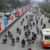 Người giao thông trên tuyến đường Giải Phóng. (Ảnh: Danh Lam/TTXVN)