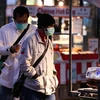 Người dân đeo khẩu trang để phòng tránh lây nhiễm COVID-19 tại Seoul, Hàn Quốc, ngày 27/2/2020. (Ảnh: THX/TTXVN)