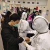 Bệnh nhân nhiễm COVID-19 được điều trị tại bệnh viện dã chiến ở Vũ Hán, tỉnh Hồ Bắc, Trung Quốc, ngày 8/2/2020. (Ảnh: THX/TTXVN)