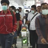 Người dân đeo khẩu trang để phòng tránh lây nhiễm COVID-19 tại nhà ga ở Jakarta, Indonesia, ngày 3/3/2020. (Ảnh: THX/TTXVN)