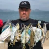 Ông Gary Stokes, người sáng lập nhóm môi trường OceansAsia, với những chiếc khẩu trang bị thải bỏ mà nhóm của ông tìm thấy trên một bãi biển ở quần đảo Soko của Hong Kong. (Nguồn: straitstimes.com