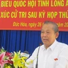 Phó Thủ tướng Trương Hòa Bình phát biểu tại buổi tiếp xúc cử tri huyện Đức Hòa (Long An). (Ảnh: Bùi Giang/TTXVN)