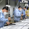 Công nhân sản xuất tại một phân xưởng của Skyworth ở Quảng Châu, thủ phủ tỉnh Quảng Đông, Trung Quốc ngày 10/2/2020. (Ảnh: THX/TTXVN)