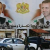 Các tấm áp phích tuyên truyền, vận động cho cuộc bầu cử Quốc hội được trưng bày tại thành phố Latakia, khu vực Alawite, Syria. (Ảnh: AFP/TTXVN)