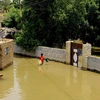 Cảnh ngập lụt tại Al-Kadaro, phía bắc thủ đô Khartoum, Sudan, ngày 31/8/2020. (Ảnh: THX/TTXVN)