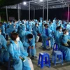 Các công dân Việt Nam từ nước ngoài về nước chuẩn bị cách ly tập trung để phòng ngừa dịch COVID-19. (Ảnh: Chanh Đa/TTXVN)